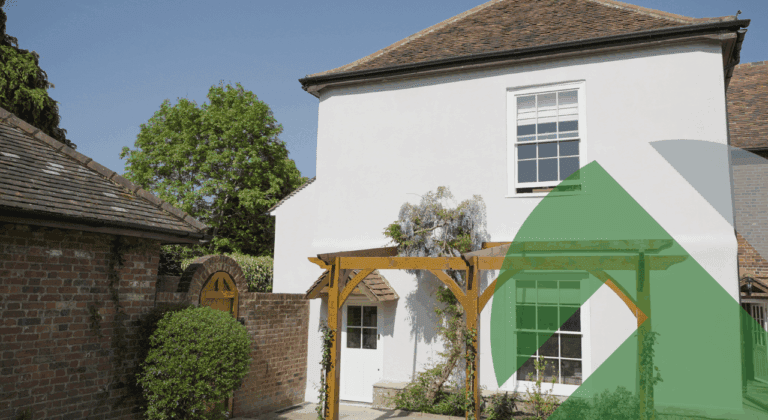 UK home with freshly rendered external wall insulation, highlighting smooth finish and energy-efficient upgrades under the Warm Homes Plan.