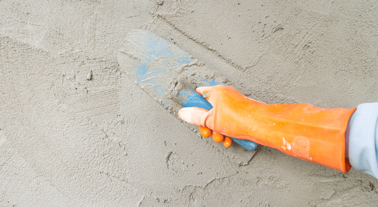 Installer applying EWI render in warm weather